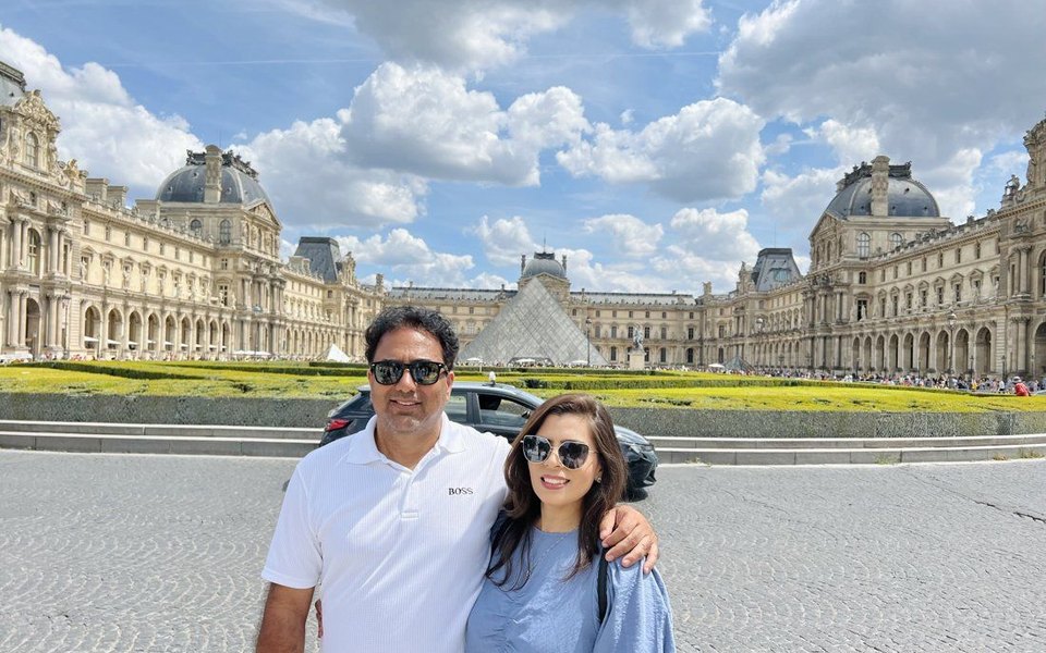 Saif Rehman and his wife outside the Louvre in Paris