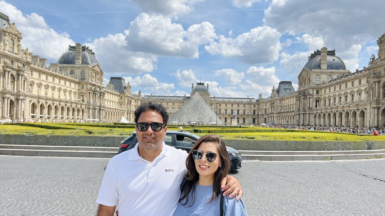 Saif Rehman and his wife outside the Louvre in Paris